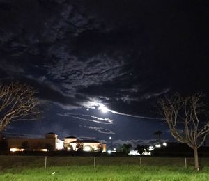Scenic view of field against sky at night