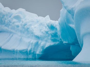 Scenic view of sea against sky during winter