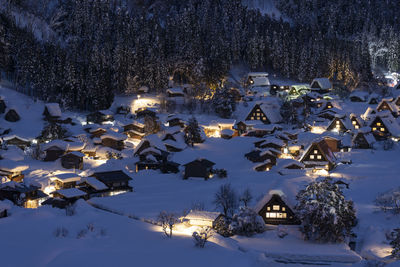 High angle view of houses on snow covered landscape
