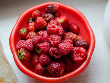 High angle view of strawberries in bowl on table