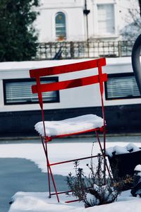 Close-up of flag against snow covered city