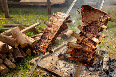 High angle view of meat on barbecue grill