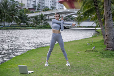 Full length of woman standing on field