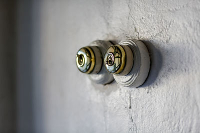 Knobs on white wall