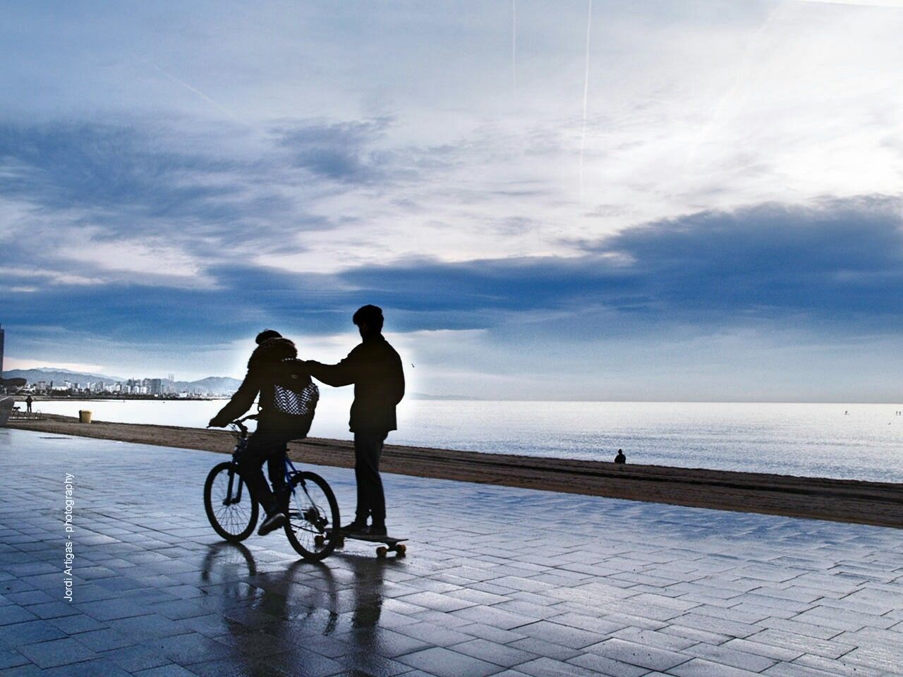 water, sea, sky, lifestyles, full length, men, leisure activity, horizon over water, cloud - sky, beach, bicycle, silhouette, transportation, togetherness, rear view, cloud, walking, shore