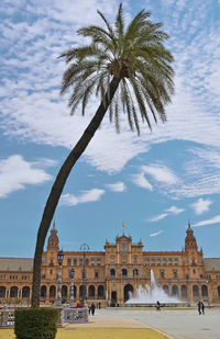 Low angle view of historical building against cloudy sky