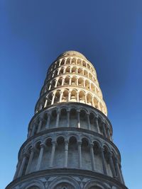 Low angle view of historical building against blue sky