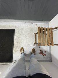 Low section of man standing on floor