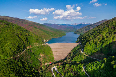 High angle view of river amidst plants against sky