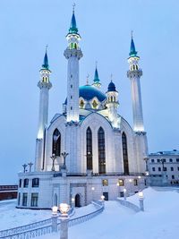 Low angle view of church against sky during winter