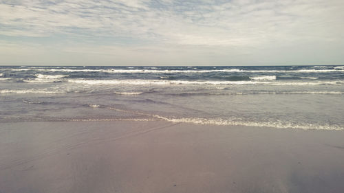 Scenic view of beach against sky