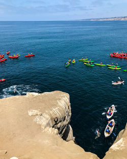 High angle view of rocks in sea against sky