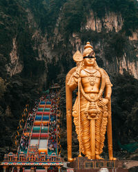 Statue of temple against building