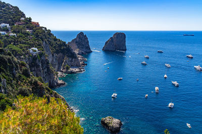 Scenic seascape from gardens of augustus viewpoint with farglioni, the most iconic sight of capri