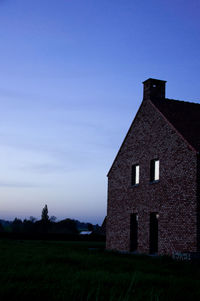 House on field against sky