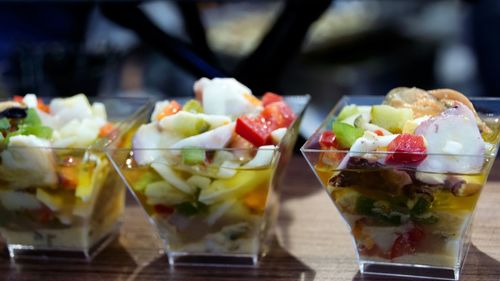 Close-up of salad in glass containers on table