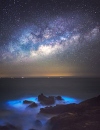 Scenic view of sea against sky at night