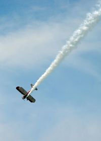 Low angle view of airplane flying in sky