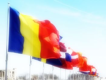 Low angle view of flag against sky