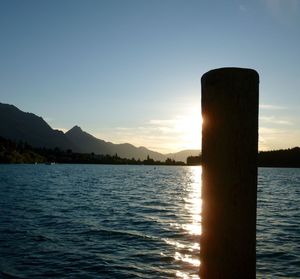 Scenic view of sea against clear sky during sunset