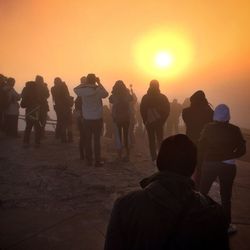 Silhouette of people at sunset