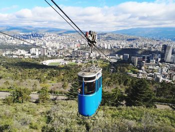 High angle view of overhead cable car against buildings