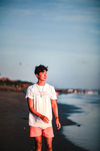 Full length of man standing on beach