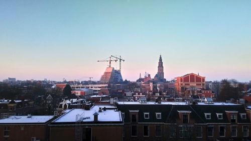 View of cityscape against clear sky