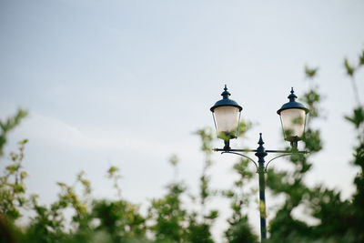 Low angle view of street light against sky