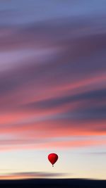 Hot air balloons against sky during sunset