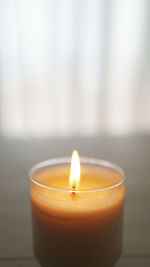 Close-up of tea light candle on table