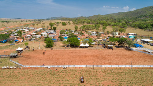 Aerial view of rural town with mountains in  background