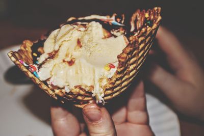 Close-up of hand holding ice cream