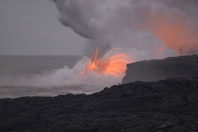 Lava flowing into the sea makes an amazing sight for visitors to hawaiiis big island, hawaii, usa