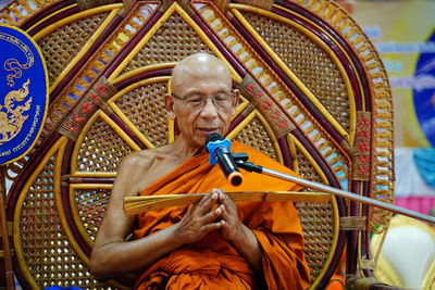 Monk speaking in ceremony