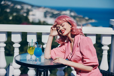 Young woman drinking glass