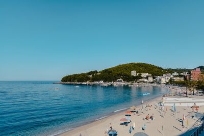 Scenic view of sea against clear blue sky
