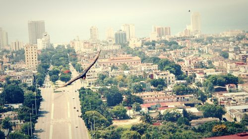 Aerial view of cityscape against sky