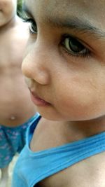 Close-up of cute boy looking away