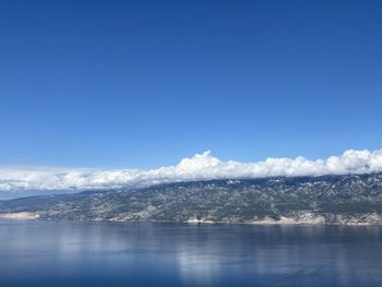 Scenic view of sea against blue sky