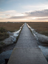 Scenic view of jetty during sunset