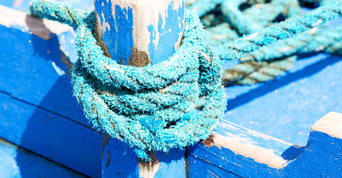 Close-up of rope tied on wood