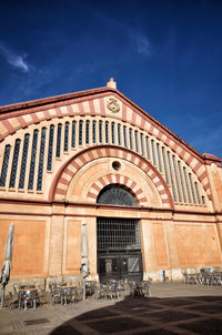 Facade of historic building against blue sky