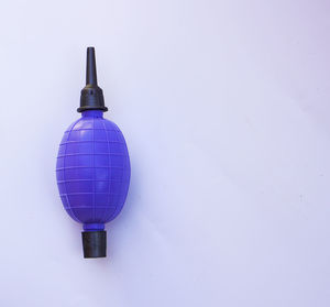 Close-up of electric lamp against white wall