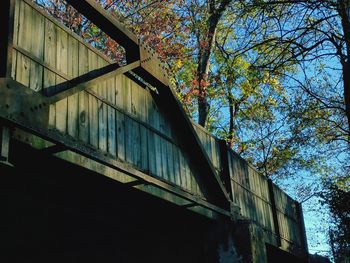 Low angle view of built structure against trees