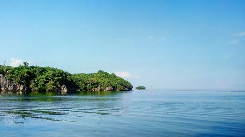 Scenic view of sea against clear blue sky