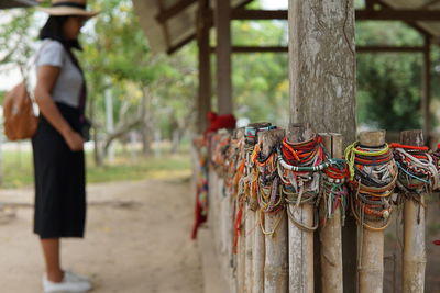 Close-up of bracelets on wooden railing