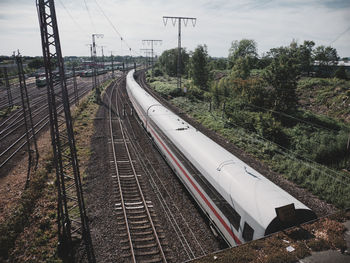 Train on railroad track against sky