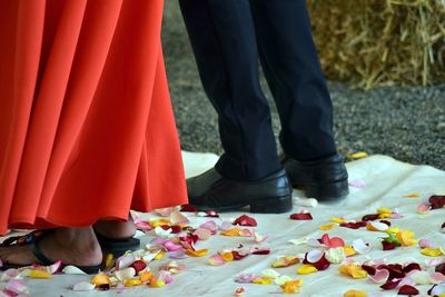 Low section of man and woman standing on floor