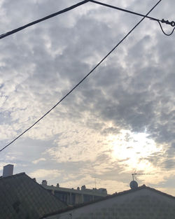 Low angle view of buildings against sky during sunset